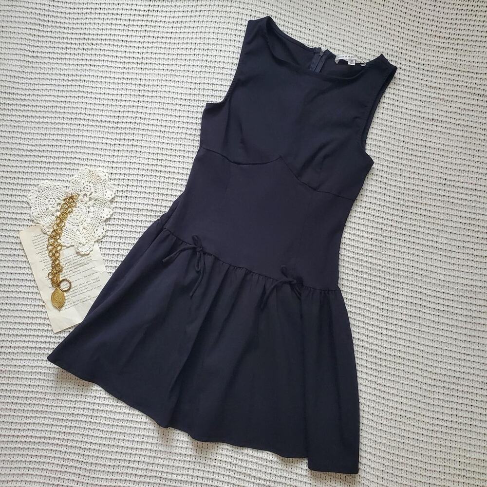 Madden girl sleeveless black drop waist dress with bows on the front